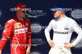 Kimi Raikkonen (FIN) Ferrari SF70H and Valtteri Bottas (FIN) Mercedes AMG F1 W08. 29.07.2017. Formula 1 World Championship, Rd 11, Hungarian Grand Prix, Budapest, Hungary, Qualifying Day.