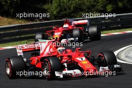 Kimi Raikkonen (FIN) Ferrari SF70H leads team mate Sebastian Vettel (GER) Ferrari SF70H. 29.07.2017. Formula 1 World Championship, Rd 11, Hungarian Grand Prix, Budapest, Hungary, Qualifying Day.