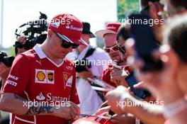Kimi Raikkonen (FIN) Ferrari signs autographs for the fans. 29.07.2017. Formula 1 World Championship, Rd 11, Hungarian Grand Prix, Budapest, Hungary, Qualifying Day.