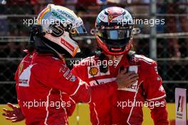 (L to R): Sebastian Vettel (GER) Ferrari celebrates his pole position with second placed team mate Kimi Raikkonen (FIN) Ferrari. 29.07.2017. Formula 1 World Championship, Rd 11, Hungarian Grand Prix, Budapest, Hungary, Qualifying Day.