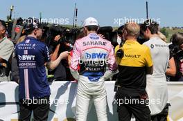 (L to R): Will Hings (GBR) Sahara Force India F1 Press Officer; Esteban Ocon (FRA) Sahara Force India F1 Team; Andy Stobart (GBR) Renault Sport F1 Team Press Officer; and Jolyon Palmer (GBR) Renault Sport F1 Team, with the media. 29.07.2017. Formula 1 World Championship, Rd 11, Hungarian Grand Prix, Budapest, Hungary, Qualifying Day.