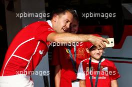 Sebastian Vettel (GER) Ferrari with young fans. 27.07.2017. Formula 1 World Championship, Rd 11, Hungarian Grand Prix, Budapest, Hungary, Preparation Day.