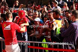 Sebastian Vettel (GER) Ferrari with a young fan. 27.07.2017. Formula 1 World Championship, Rd 11, Hungarian Grand Prix, Budapest, Hungary, Preparation Day.