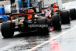 Daniel Ricciardo (AUS) Red Bull Racing RB13 and Max Verstappen (NLD) Red Bull Racing RB13 at the pit lane exit. 02.09.2017. Formula 1 World Championship, Rd 13, Italian Grand Prix, Monza, Italy, Qualifying Day.