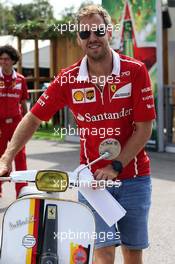 Sebastian Vettel (GER) Ferrari with his moped. 31.08.2017. Formula 1 World Championship, Rd 13, Italian Grand Prix, Monza, Italy, Preparation Day.