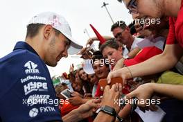 Esteban Ocon (FRA) Sahara Force India F1 Team signs autographs for the fans. 31.08.2017. Formula 1 World Championship, Rd 13, Italian Grand Prix, Monza, Italy, Preparation Day.