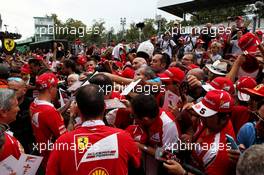 Kimi Raikkonen (FIN) Ferrari signs autographs for the fans. 31.08.2017. Formula 1 World Championship, Rd 13, Italian Grand Prix, Monza, Italy, Preparation Day.