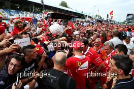 Kimi Raikkonen (FIN) Ferrari signs autographs for the fans. 31.08.2017. Formula 1 World Championship, Rd 13, Italian Grand Prix, Monza, Italy, Preparation Day.