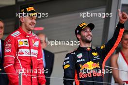 (L to R): Race winner Sebastian Vettel (GER) Ferrari celebrates on the podium with third placed Daniel Ricciardo (AUS) Red Bull Racing. 28.05.2017. Formula 1 World Championship, Rd 6, Monaco Grand Prix, Monte Carlo, Monaco, Race Day.