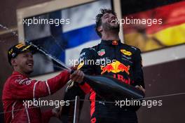 Daniel Ricciardo (AUS) Red Bull Racing celebrates his third position on the podium with race winner Sebastian Vettel (GER) Ferrari. 28.05.2017. Formula 1 World Championship, Rd 6, Monaco Grand Prix, Monte Carlo, Monaco, Race Day.