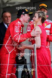 Kimi Raikkonen (FIN) Ferrari celebrates his second position on the podium with Princess Charlene of Monaco. 28.05.2017. Formula 1 World Championship, Rd 6, Monaco Grand Prix, Monte Carlo, Monaco, Race Day.