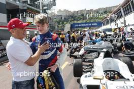 Robert Shwartzman (RUS) Formula Renault Eurocup Driver with Boris Rotenberg (RUS) SMP Bank and SGM Group Co-Owner. 28.05.2017. Formula 1 World Championship, Rd 6, Monaco Grand Prix, Monte Carlo, Monaco, Race Day.