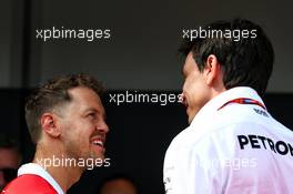 (L to R): Sebastian Vettel (GER) Ferrari with Toto Wolff (GER) Mercedes AMG F1 Shareholder and Executive Director. 25.05.2017. Formula 1 World Championship, Rd 6, Monaco Grand Prix, Monte Carlo, Monaco, Practice Day.