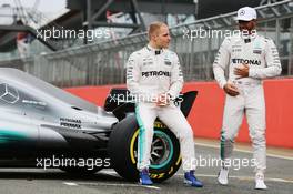 (L to R): Valtteri Bottas (FIN) Mercedes AMG F1 W08 with team mate Lewis Hamilton (GBR) Mercedes AMG F1. 23.02.2017. Mercedes AMG F1 W08 Launch, Silverstone, England.