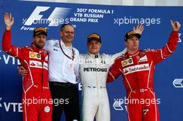 The podium (L to R): Sebastian Vettel (GER) Ferrari, second; Tony Ross (GBR) Mercedes AMG F1 Race Engineer; Valtteri Bottas (FIN) Mercedes AMG F1, race winner; Kimi Raikkonen (FIN) Ferrari, third. 30.04.2017. Formula 1 World Championship, Rd 4, Russian Grand Prix, Sochi Autodrom, Sochi, Russia, Race Day.