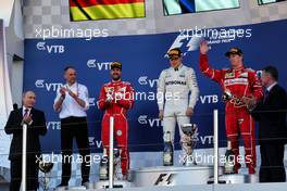 The podium (L to R): Sebastian Vettel (GER) Ferrari, second; Valtteri Bottas (FIN) Mercedes AMG F1, race winner; Kimi Raikkonen (FIN) Ferrari, third. 30.04.2017. Formula 1 World Championship, Rd 4, Russian Grand Prix, Sochi Autodrom, Sochi, Russia, Race Day.