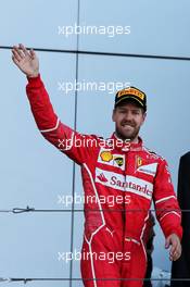 Sebastian Vettel (GER) Ferrari celebrates his second position on the podium. 30.04.2017. Formula 1 World Championship, Rd 4, Russian Grand Prix, Sochi Autodrom, Sochi, Russia, Race Day.