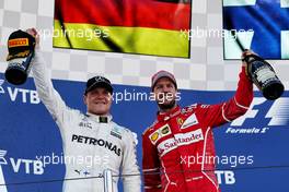 (L to R): Race winner Sebastian Vettel (GER) Ferrari celebrates on the podium with second placed Sebastian Vettel (GER) Ferrari. 30.04.2017. Formula 1 World Championship, Rd 4, Russian Grand Prix, Sochi Autodrom, Sochi, Russia, Race Day.
