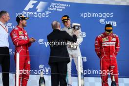 The podium (L to R): Sebastian Vettel (GER) Ferrari, second; Vladimir Putin (RUS) Russian Federation President; Valtteri Bottas (FIN) Mercedes AMG F1, race winner; Kimi Raikkonen (FIN) Ferrari, third. 30.04.2017. Formula 1 World Championship, Rd 4, Russian Grand Prix, Sochi Autodrom, Sochi, Russia, Race Day.