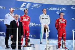 The podium (L to R): Tony Ross (GBR) Mercedes AMG F1 Race Engineer; Vladimir Putin (RUS) Russian Federation President; Sebastian Vettel (GER) Ferrari, second; Valtteri Bottas (FIN) Mercedes AMG F1, race winner; Kimi Raikkonen (FIN) Ferrari, third. 30.04.2017. Formula 1 World Championship, Rd 4, Russian Grand Prix, Sochi Autodrom, Sochi, Russia, Race Day.