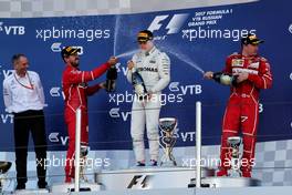 The podium (L to R): Sebastian Vettel (GER) Ferrari, second; Valtteri Bottas (FIN) Mercedes AMG F1, race winner; Kimi Raikkonen (FIN) Ferrari, third. 30.04.2017. Formula 1 World Championship, Rd 4, Russian Grand Prix, Sochi Autodrom, Sochi, Russia, Race Day.