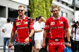 Sebastian Vettel (GER) Ferrari with Antti Kontsas (FIN) Personal Trainer. 15.09.2017. Formula 1 World Championship, Rd 14, Singapore Grand Prix, Marina Bay Street Circuit, Singapore, Practice Day.