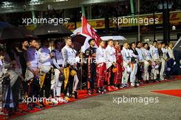 The drivers as the grid observes the national anthem.                                17.09.2017. Formula 1 World Championship, Rd 14, Singapore Grand Prix, Marina Bay Street Circuit, Singapore, Race Day.