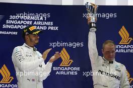 1st place Lewis Hamilton (GBR) Mercedes AMG F1 W08 and 3rd place Valtteri Bottas (FIN) Mercedes AMG F1 W08. 17.09.2017. Formula 1 World Championship, Rd 14, Singapore Grand Prix, Marina Bay Street Circuit, Singapore, Race Day.