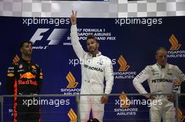 1st place Lewis Hamilton (GBR) Mercedes AMG F1 W08, 2nd for Daniel Ricciardo (AUS) Red Bull Racing RB13 and 3rd for Valtteri Bottas (FIN) Mercedes AMG F1. 17.09.2017. Formula 1 World Championship, Rd 14, Singapore Grand Prix, Marina Bay Street Circuit, Singapore, Race Day.