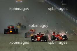 Sebastian Vettel (GER) Ferrari SF70H, Kimi Raikkonen (FIN) Ferrari SF70H, and Max Verstappen (NLD) Red Bull Racing RB13, crash at the start of the race 17.09.2017. Formula 1 World Championship, Rd 14, Singapore Grand Prix, Marina Bay Street Circuit, Singapore, Race Day.