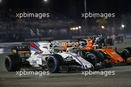Felipe Massa (BRA) Williams FW40 and Stoffel Vandoorne (BEL) McLaren MCL32. 17.09.2017. Formula 1 World Championship, Rd 14, Singapore Grand Prix, Marina Bay Street Circuit, Singapore, Race Day.