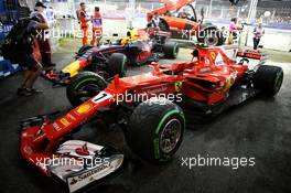 The damaged Ferrari SF70H of Kimi Raikkonen (FIN) Ferrari and Red Bull Racing RB13 of Max Verstappen (NLD) Red Bull Racing after they crashed at the start of the race. 17.09.2017. Formula 1 World Championship, Rd 14, Singapore Grand Prix, Marina Bay Street Circuit, Singapore, Race Day.