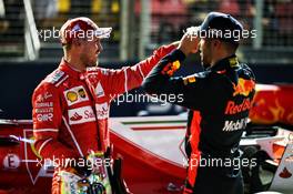 (L to R): pole sitter Sebastian Vettel (GER) Ferrari with Daniel Ricciardo (AUS) Red Bull Racing in qualifying parc ferme. 16.09.2017. Formula 1 World Championship, Rd 14, Singapore Grand Prix, Marina Bay Street Circuit, Singapore, Qualifying Day.