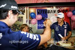 Esteban Ocon (FRA) Sahara Force India F1 Team celebrates his 21st birthday with team mate Sergio Perez (MEX) Sahara Force India F1. 16.09.2017. Formula 1 World Championship, Rd 14, Singapore Grand Prix, Marina Bay Street Circuit, Singapore, Qualifying Day.
