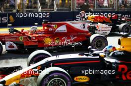 Pole sitter Sebastian Vettel (GER) Ferrari SF70H with Max Verstappen (NLD) Red Bull Racing RB13 and Daniel Ricciardo (AUS) Red Bull Racing RB13 in qualifying parc ferme. 16.09.2017. Formula 1 World Championship, Rd 14, Singapore Grand Prix, Marina Bay Street Circuit, Singapore, Qualifying Day.