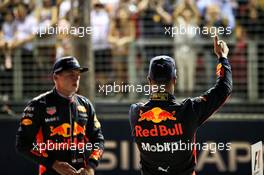 Daniel Ricciardo (AUS) Red Bull Racing celebrates his third position in qualifying parc ferme with team mate Max Verstappen (NLD) Red Bull Racing. 16.09.2017. Formula 1 World Championship, Rd 14, Singapore Grand Prix, Marina Bay Street Circuit, Singapore, Qualifying Day.