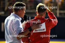 (L to R): Will Buxton (GBR) NBC Sports Network TV Presenter with psiot Sebastian Vettel (GER) Ferrari in qualifying parc ferme. 16.09.2017. Formula 1 World Championship, Rd 14, Singapore Grand Prix, Marina Bay Street Circuit, Singapore, Qualifying Day.