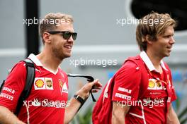 Sebastian Vettel (GER) Ferrari with Antti Kontsas (FIN) Personal Trainer. 16.09.2017. Formula 1 World Championship, Rd 14, Singapore Grand Prix, Marina Bay Street Circuit, Singapore, Qualifying Day.