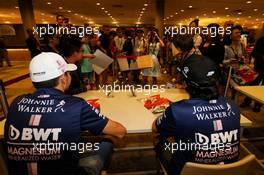 (L to R): Esteban Ocon (FRA) Sahara Force India F1 Team and Sergio Perez (MEX) Sahara Force India F1 sign autographs for the fans. 14.09.2017. Formula 1 World Championship, Rd 14, Singapore Grand Prix, Marina Bay Street Circuit, Singapore, Preparation Day.