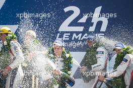 Race winners Brendon Hartley (NZL), Earl Bamber (NZL), Timo Bernhard (GER) #02 Porsche LMP Team, Porsche 919 Hybrid, celebrate on the podium. FIA World Endurance Championship, Le Mans 24 Hours - Race, Sunday 18th June 2017. Le Mans, France.