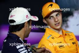 Oscar Piastri (AUS) McLaren and Sergio Perez (MEX) Red Bull Racing in the FIA Press Conference. 02.05.2024. Formula 1 World Championship, Rd 6, Miami Grand Prix, Miami, Florida, USA, Preparation Day.