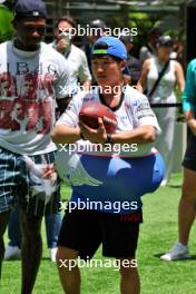 Yuki Tsunoda (JPN) RB plays American football in the paddock. 02.05.2024. Formula 1 World Championship, Rd 6, Miami Grand Prix, Miami, Florida, USA, Preparation Day.
