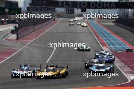 (L to R): Dries Vanthoor (BEL) / Raffaele Marciello (ITA) / Marco Wittmann (GER) #15 BMW M Team WRT BMW M Hybrid V8 and Robert Kubica (POL) / Robert Shwartzman (ISR) / Yifei Ye (CHN) #83 AF Corse Ferrari 499P battle for position. 02.03.2024. FIA World Endurance Championship, Round 1, Doha 1812 KM, Doha, Qatar, Saturday.